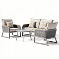 Outdoor patio furniture set with woven rattan seating and gray cushions