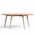Round wooden dining table with tapered legs for modern interiors 140 x 140 x 75cm